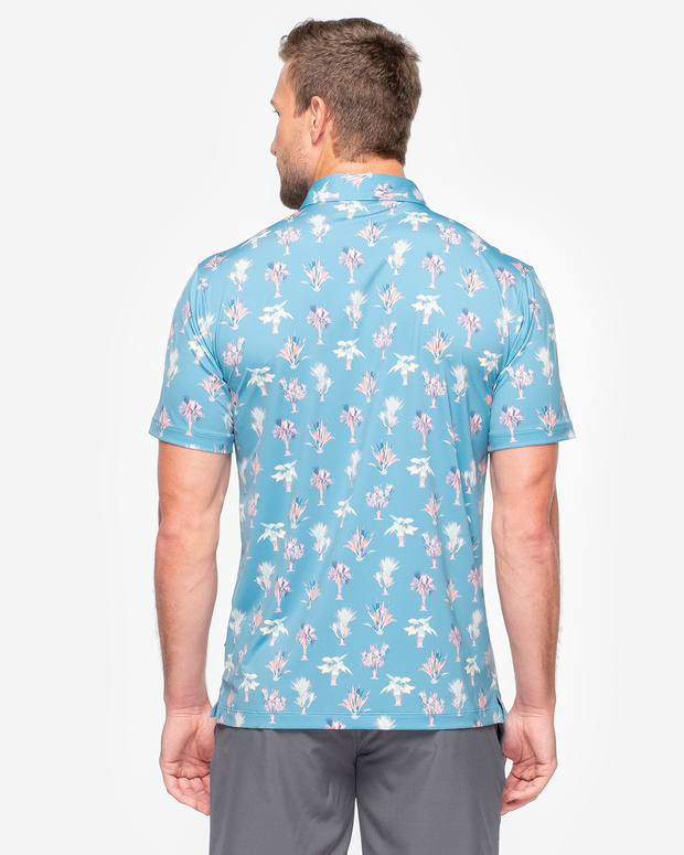Turquoise blue Devereux golf polo with peach and light yellow all over palm print 
