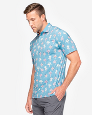 Turquoise blue Devereux golf polo with peach and light yellow all over palm print 