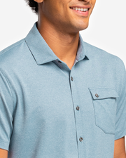 Blue-green textured short sleeve button down with asymmetric left chest pocket with button