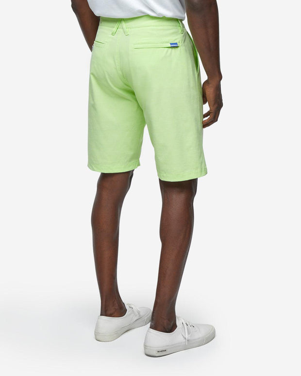 Lime neon green golf shorts with with blue accent button