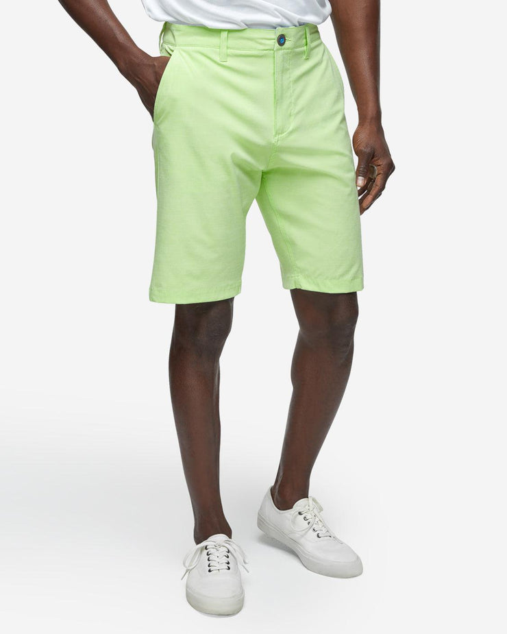 Lime neon green golf shorts with with blue accent button