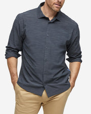 Heather black textured breathable and stretchy long sleeve button down paired with khaki pants