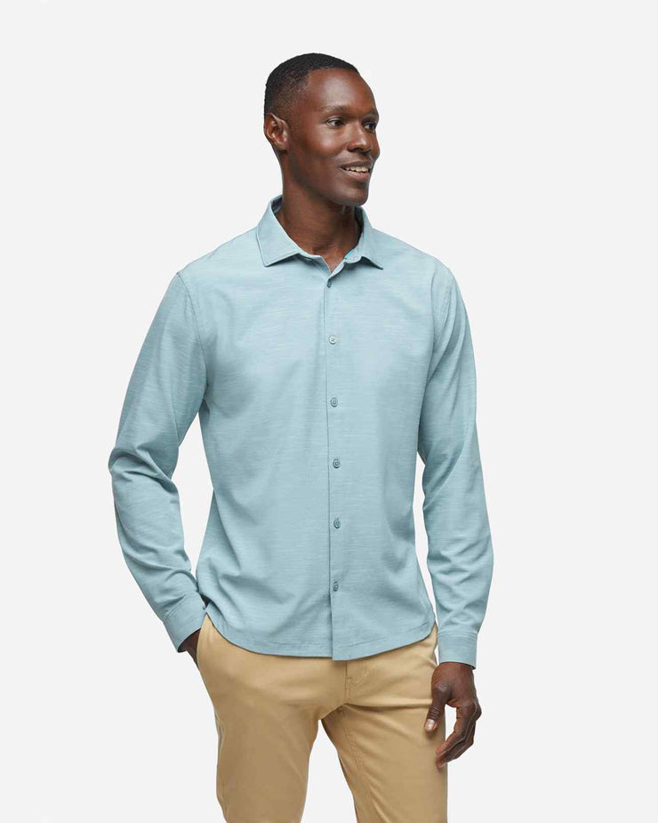 Green-grey breathable and stretchy long sleeve button down paired with khaki pants