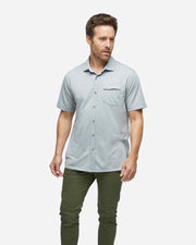 Grey textured short sleeve button down with asymmetric left chest pocket with button paired with army green pants