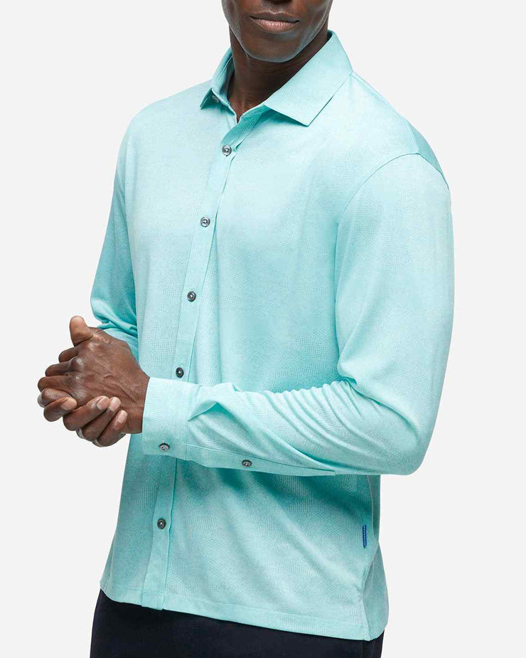 Turquoise blue performance jersey long sleeve button down with subtle mesh camo design